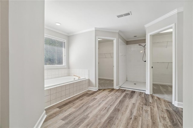 1755 Pinetree Pass Ln SW, Lilburn, GA 30047 - bathroom with a shower stall, wood finished floors, ornamental molding, and visible vents