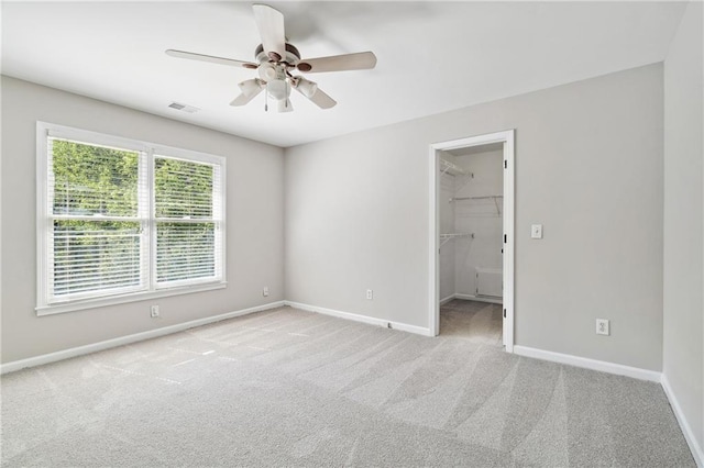 1755 Pinetree Pass Ln SW, Lilburn, GA 30047 - unfurnished bedroom featuring baseboards, a spacious closet, visible vents, and carpet floors