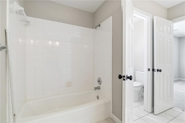 1755 Pinetree Pass Ln SW, Lilburn, GA 30047 - full bath with tile patterned floors, toilet, baseboards, and shower / bathtub combination