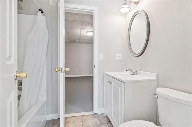 1755 Pinetree Pass Ln SW, Lilburn, GA 30047 - bathroom with vanity, a paneled ceiling, baseboards, shower / tub combo with curtain, and toilet