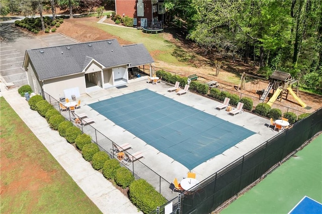 1755 Pinetree Pass Ln SW, Lilburn, GA 30047 - view of swimming pool featuring a fenced in pool, a patio, playground community, a yard, and fence