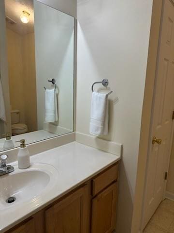 2991 Greyhawk Ln, Cumming, GA 30040 - bathroom featuring toilet and vanity