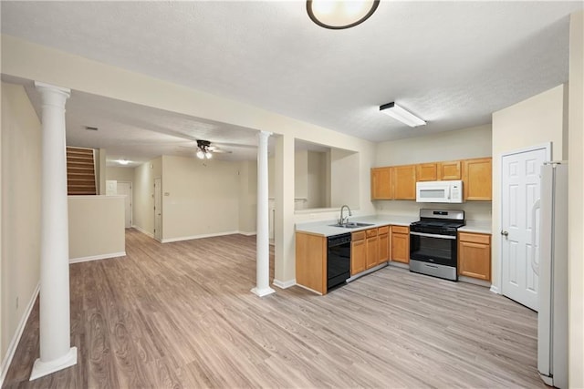 2991 Greyhawk Ln, Cumming, GA 30040 - kitchen featuring a sink, open floor plan, light countertops, white appliances, and light wood finished floors