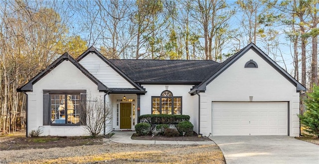 view of front of home featuring a front yard and a garage