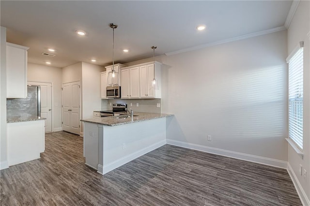 kitchen featuring white cabinets, hanging light fixtures, kitchen peninsula, stainless steel appliances, and plenty of natural light