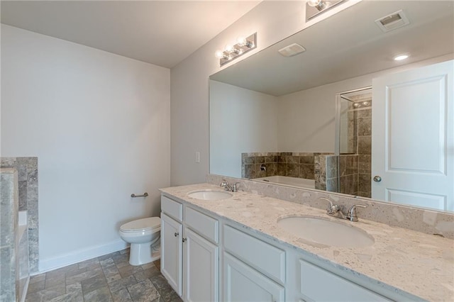 full bathroom featuring vanity, toilet, and separate shower and tub