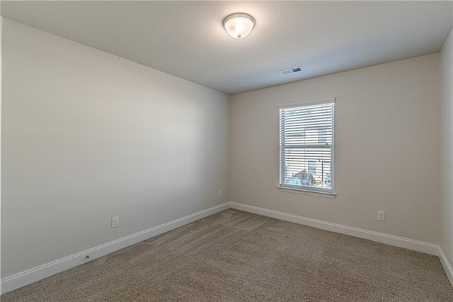 unfurnished room featuring carpet flooring