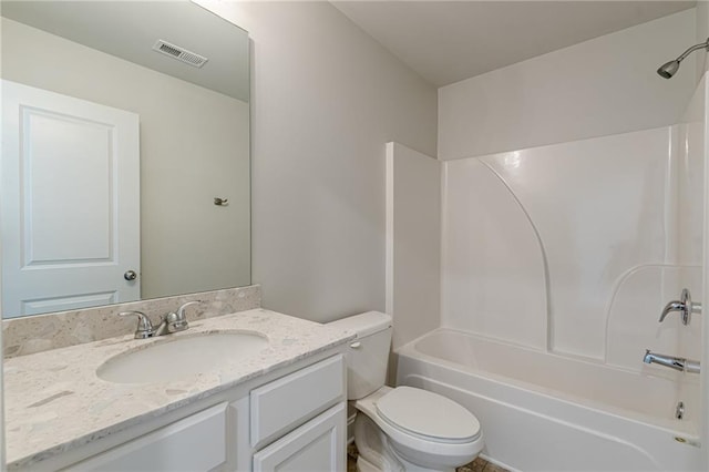 full bathroom featuring shower / tub combination, vanity, and toilet