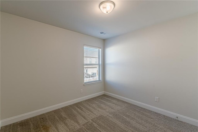 unfurnished room with carpet flooring