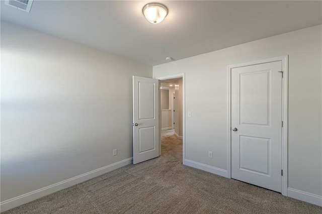 unfurnished bedroom with carpet floors