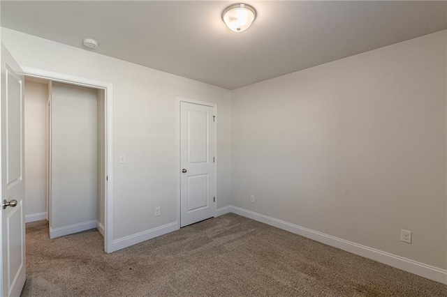 unfurnished bedroom with carpet floors