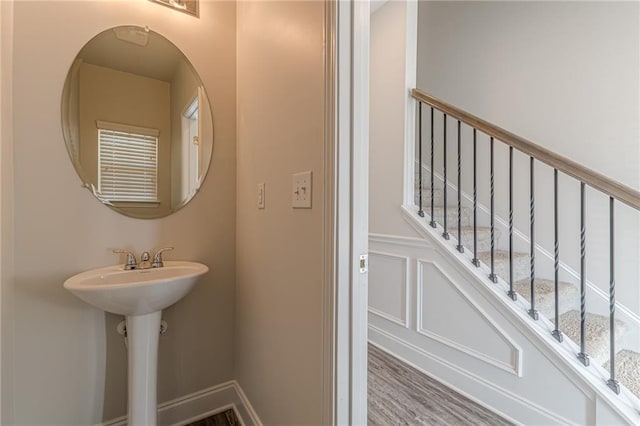 bathroom with hardwood / wood-style flooring