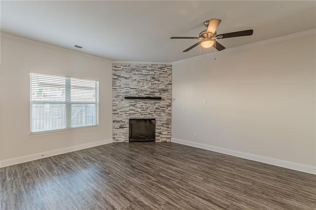 unfurnished living room with crown molding, dark hardwood / wood-style floors, ceiling fan, and a fireplace