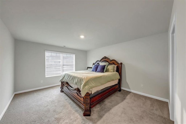 bedroom featuring light colored carpet