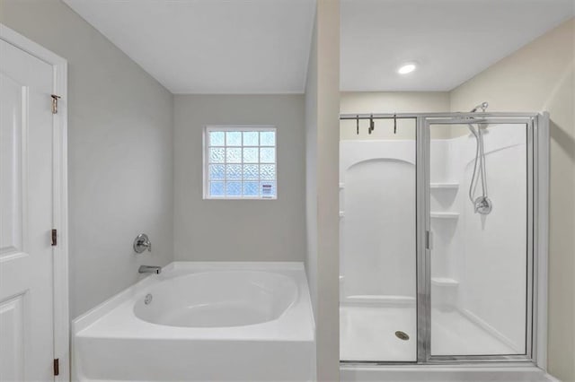 bathroom featuring plus walk in shower