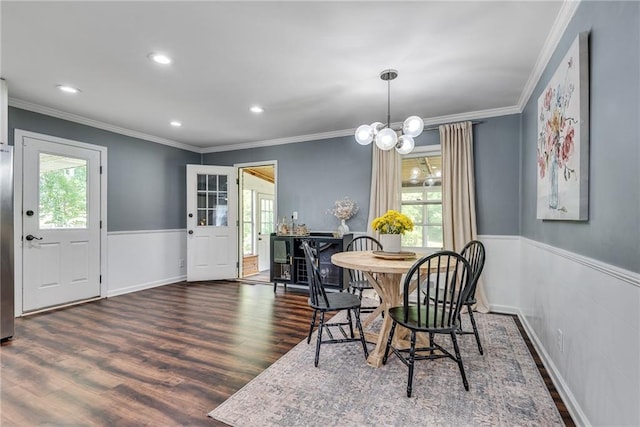 2653 Elkhart Cir SW, Marietta, GA 30064 - dining area featuring healthy amount of natural light, wainscoting, crown molding, wood finished floors, and recessed lighting