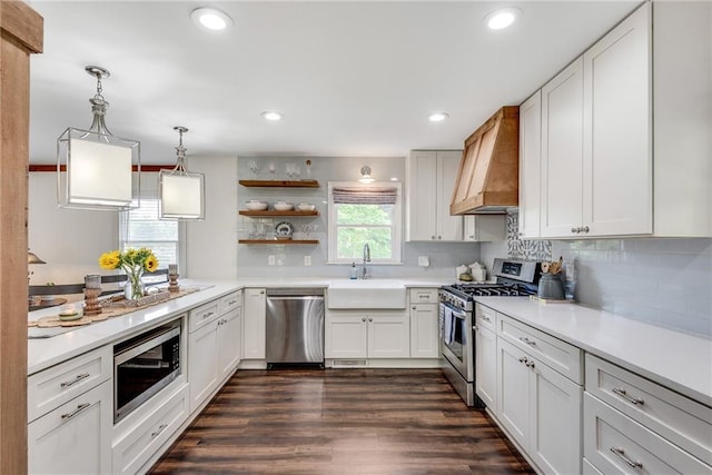 2653 Elkhart Cir SW, Marietta, GA 30064 - kitchen with appliances with stainless steel finishes, custom exhaust hood, a sink, open shelves, and light countertops