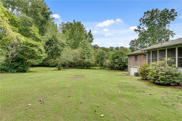 2653 Elkhart Cir SW, Marietta, GA 30064 - view of green lawn with a garage and central AC unit