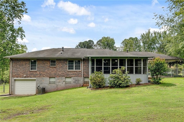 2653 Elkhart Cir SW, Marietta, GA 30064 - rear view of property with a garage, brick siding, cooling unit, and a sunroom