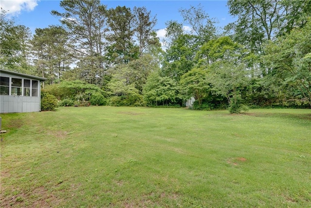 2653 Elkhart Cir SW, Marietta, GA 30064 - view of grassy yard featuring a sunroom