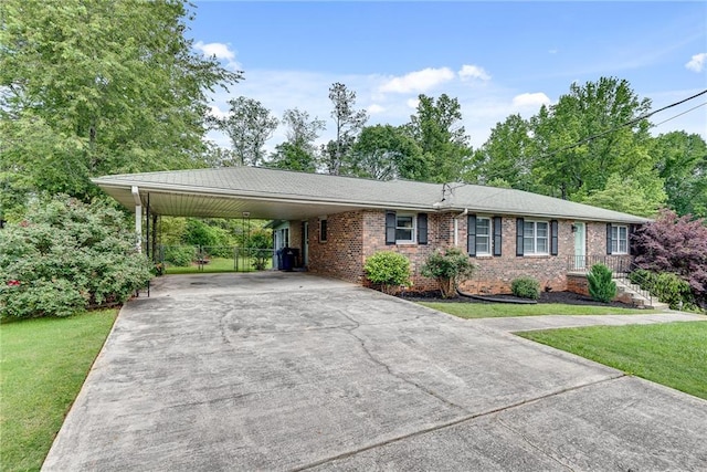 2653 Elkhart Cir SW, Marietta, GA 30064 - single story home with concrete driveway, brick siding, and a carport