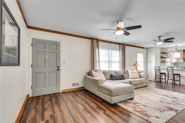 2653 Elkhart Cir SW, Marietta, GA 30064 - living area featuring crown molding, dark wood-type flooring, baseboards, and ceiling fan