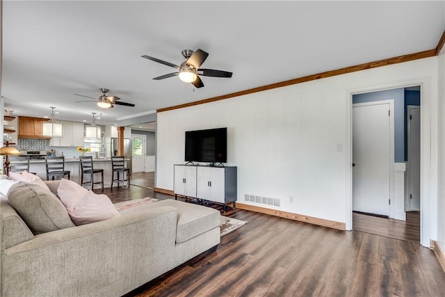 2653 Elkhart Cir SW, Marietta, GA 30064 - living area with dark wood-style floors, a ceiling fan, crown molding, and baseboards