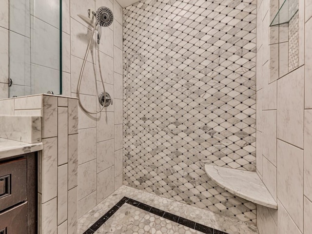 3771 Club Dr NW, Kennesaw, GA 30144 - bathroom with inlaid floor details, tiled shower, and vanity