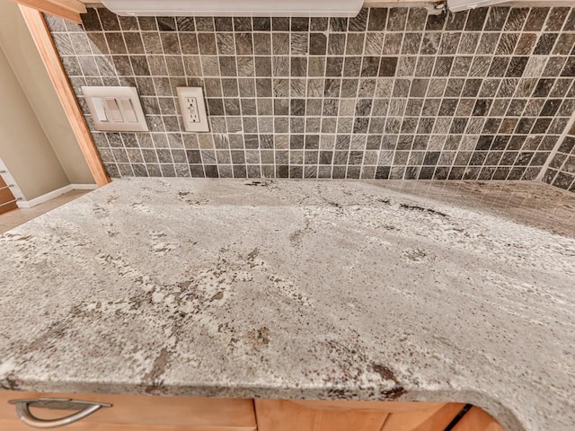 3771 Club Dr NW, Kennesaw, GA 30144 - detailed view of backsplash, light stone countertops, and baseboards