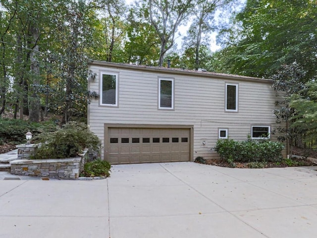 3771 Club Dr NW, Kennesaw, GA 30144 - view of front of house featuring a garage and concrete driveway