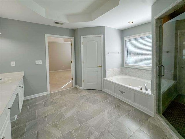 3195 Vickery Dr, Marietta, GA 30066 - full bath with a shower stall, a jetted tub, vanity, a raised ceiling, and baseboards