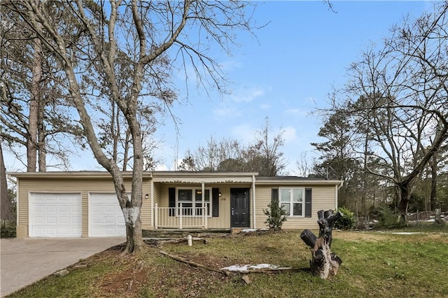 single story home featuring a porch, a garage, and a front lawn