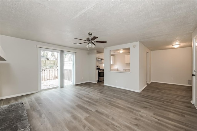 unfurnished living room with hardwood / wood-style flooring, a textured ceiling, and ceiling fan