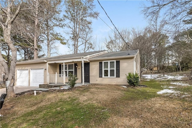 view of front of property with a garage and a front yard