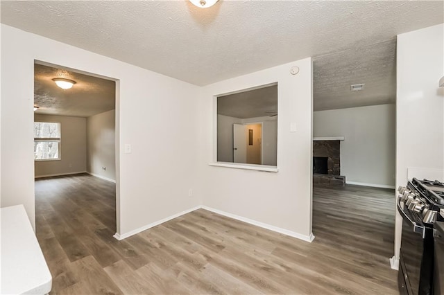 interior space with hardwood / wood-style floors and a textured ceiling