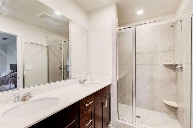 full bathroom featuring a stall shower, ensuite bath, and a sink