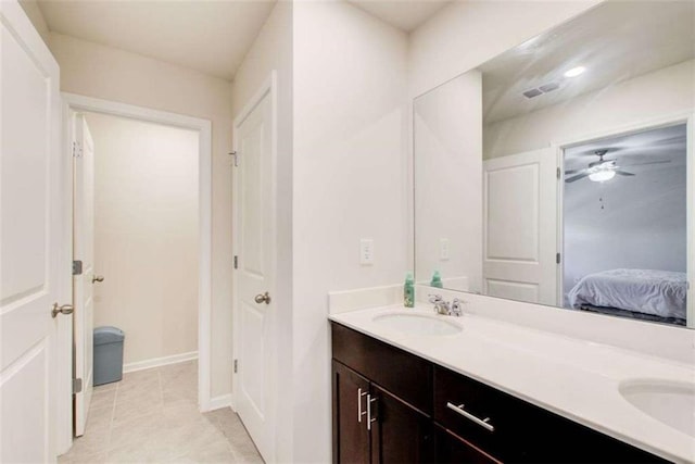 full bath with tile patterned flooring, a sink, visible vents, double vanity, and ensuite bath