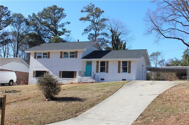 view of front of property with a front yard and a carport