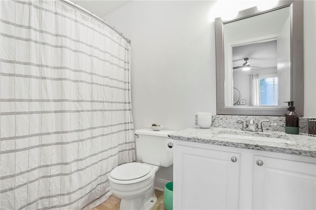 1303 Wingate Way, Atlanta, GA 30350 - bathroom featuring toilet, vanity, a ceiling fan, wood finished floors, and a shower with curtain