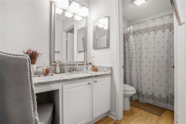 1303 Wingate Way, Atlanta, GA 30350 - bathroom featuring toilet, wood finished floors, vanity, and curtained shower