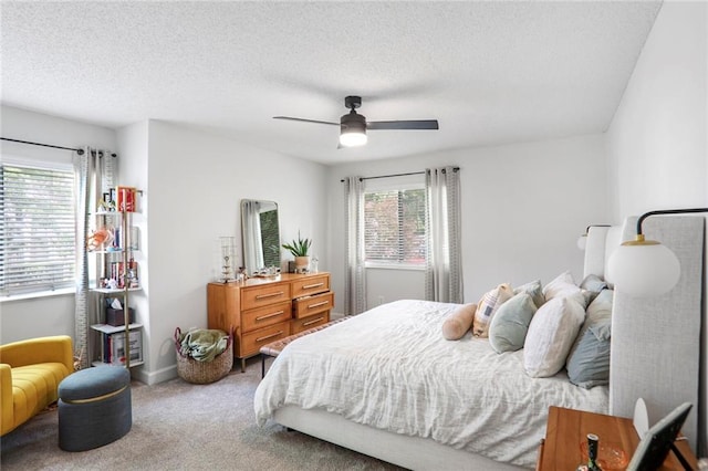 1303 Wingate Way, Atlanta, GA 30350 - carpeted bedroom with a ceiling fan, a textured ceiling, and baseboards