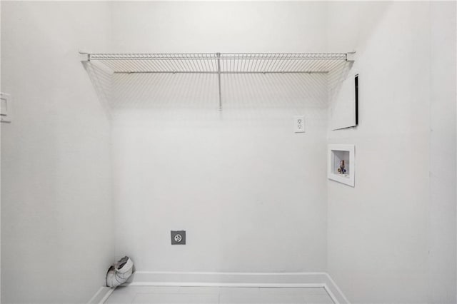 laundry area featuring hookup for an electric dryer, tile patterned flooring, and washer hookup