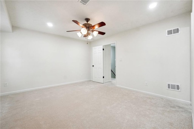 carpeted empty room featuring ceiling fan