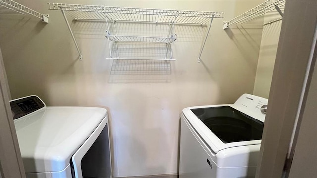 laundry area with independent washer and dryer