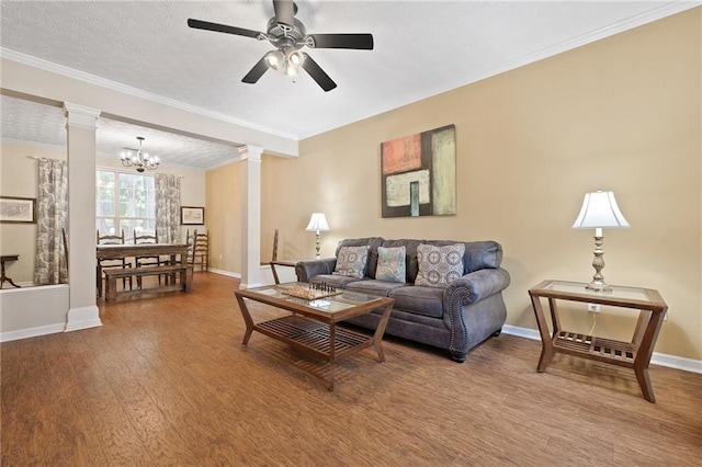 1065 Dalby Way, Austell, GA 30106 - living area with ornate columns, baseboards, wood finished floors, a chandelier, and ornamental molding
