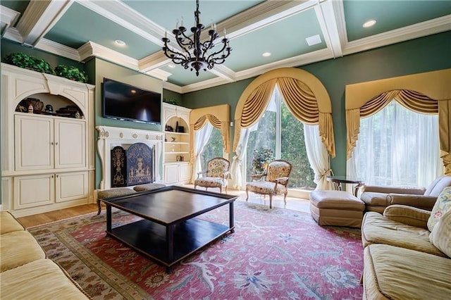 living room featuring plenty of natural light, ornamental molding, an inviting chandelier, and coffered ceiling