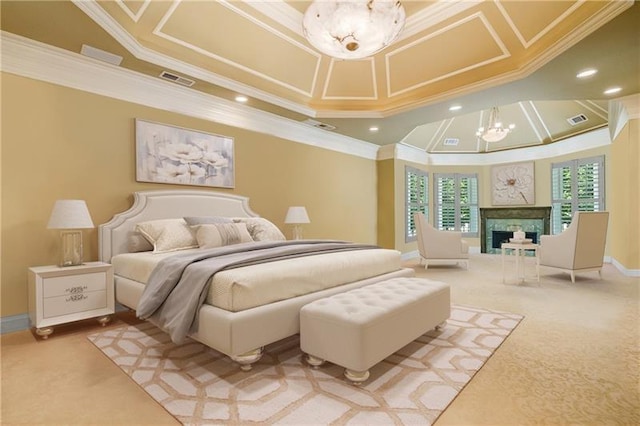 bedroom with an inviting chandelier, ornamental molding, and carpet