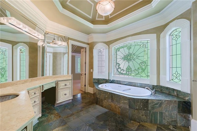 bathroom with ornamental molding, a relaxing tiled tub, plenty of natural light, and vanity