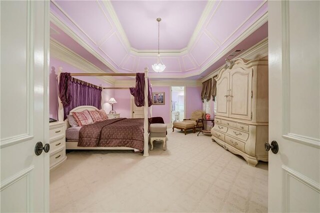 bedroom with light colored carpet, a tray ceiling, and ornamental molding