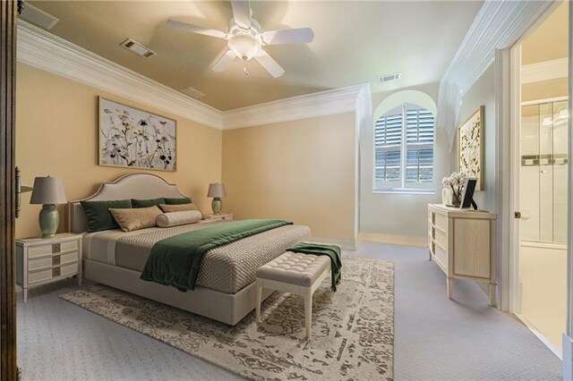 carpeted bedroom featuring ceiling fan and crown molding